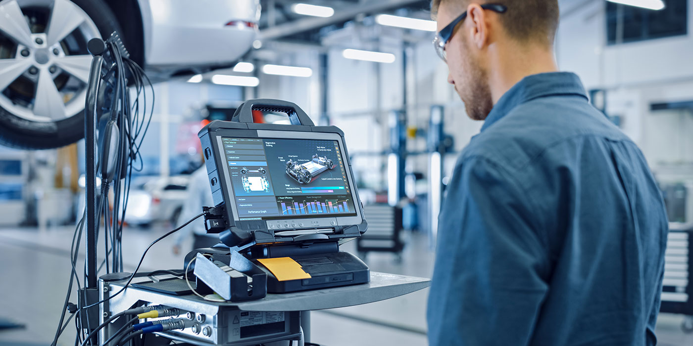 Automotive technician diagnosing a vehicle